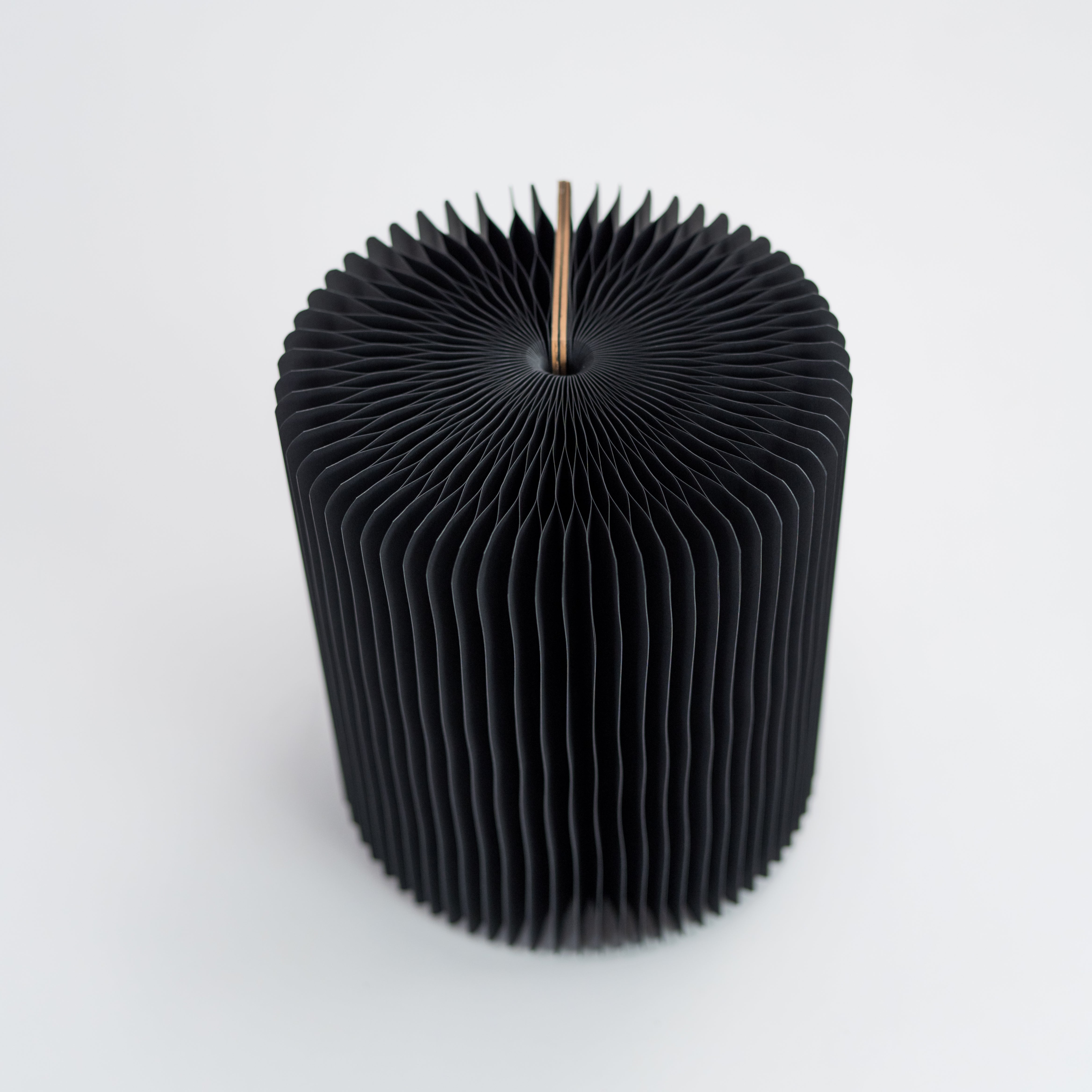 Foldable paper stools, stylish, durable, and eco-friendly for versatile seating.