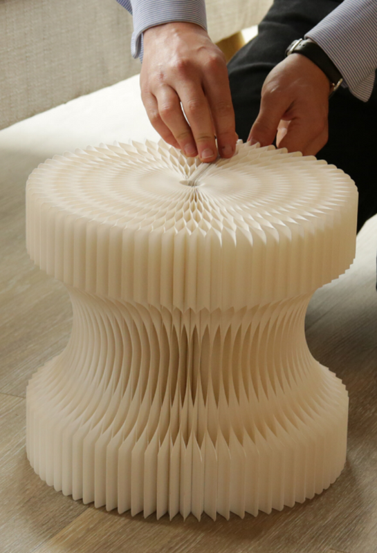 Sculpted paper seat being assembled