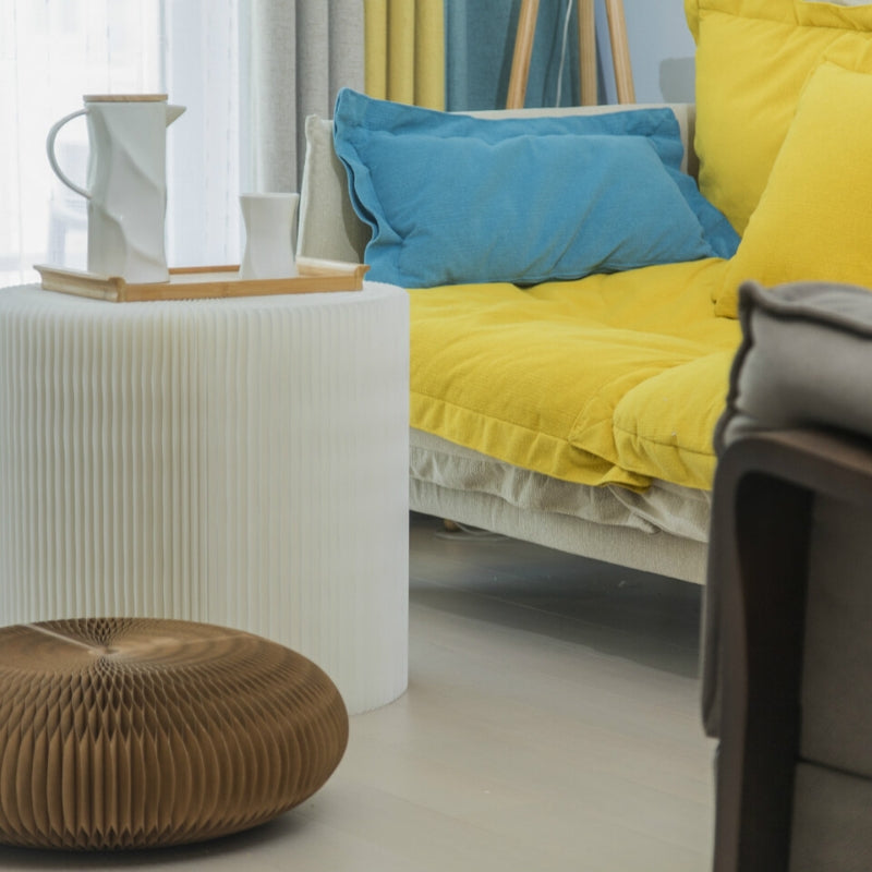 White paper coffee table with brown foot stool